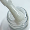 Base Gel Milky Glow AMERICAN CREATOR, base camuflaje, blanco lechoso con micro brillo, 15 ml